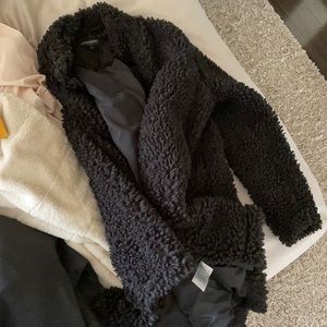 Like new teddy coat sits at butt